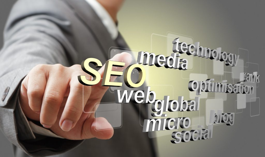 business man hand touch 3d SEO search engine optimization as concept