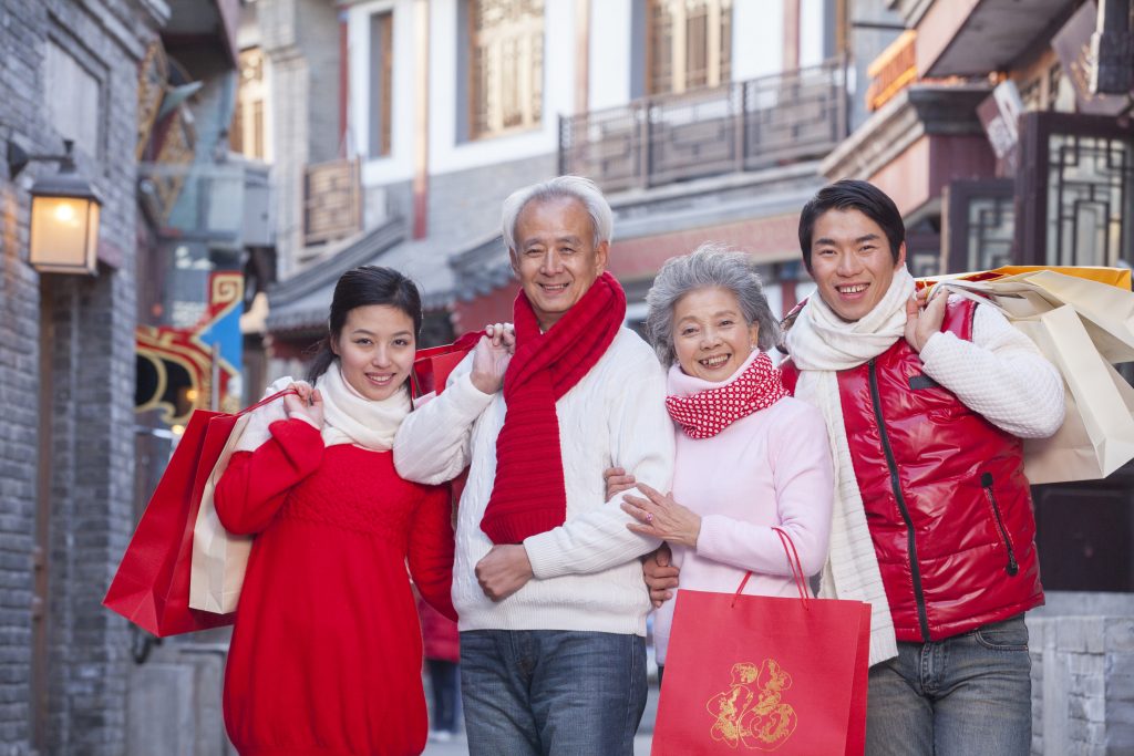 Family shopping together dressed in holiday attire